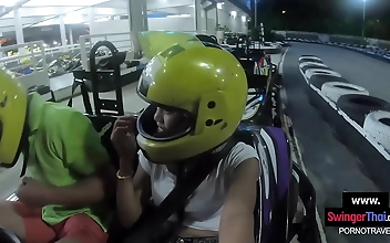 Get your adrenaline pumping with thrilling go-karting action, followed by steamy sex with a voluptuous Thai teen and her insatiable lover